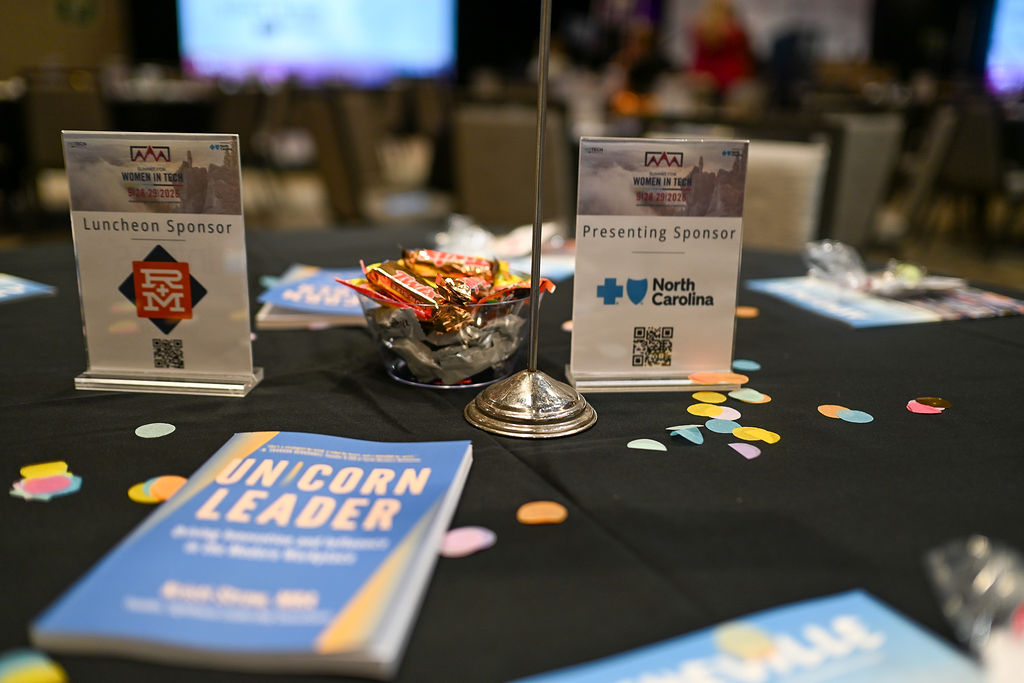 Copies of UNICORN Leader on a table at the NC TECH Summit for Women in Tech